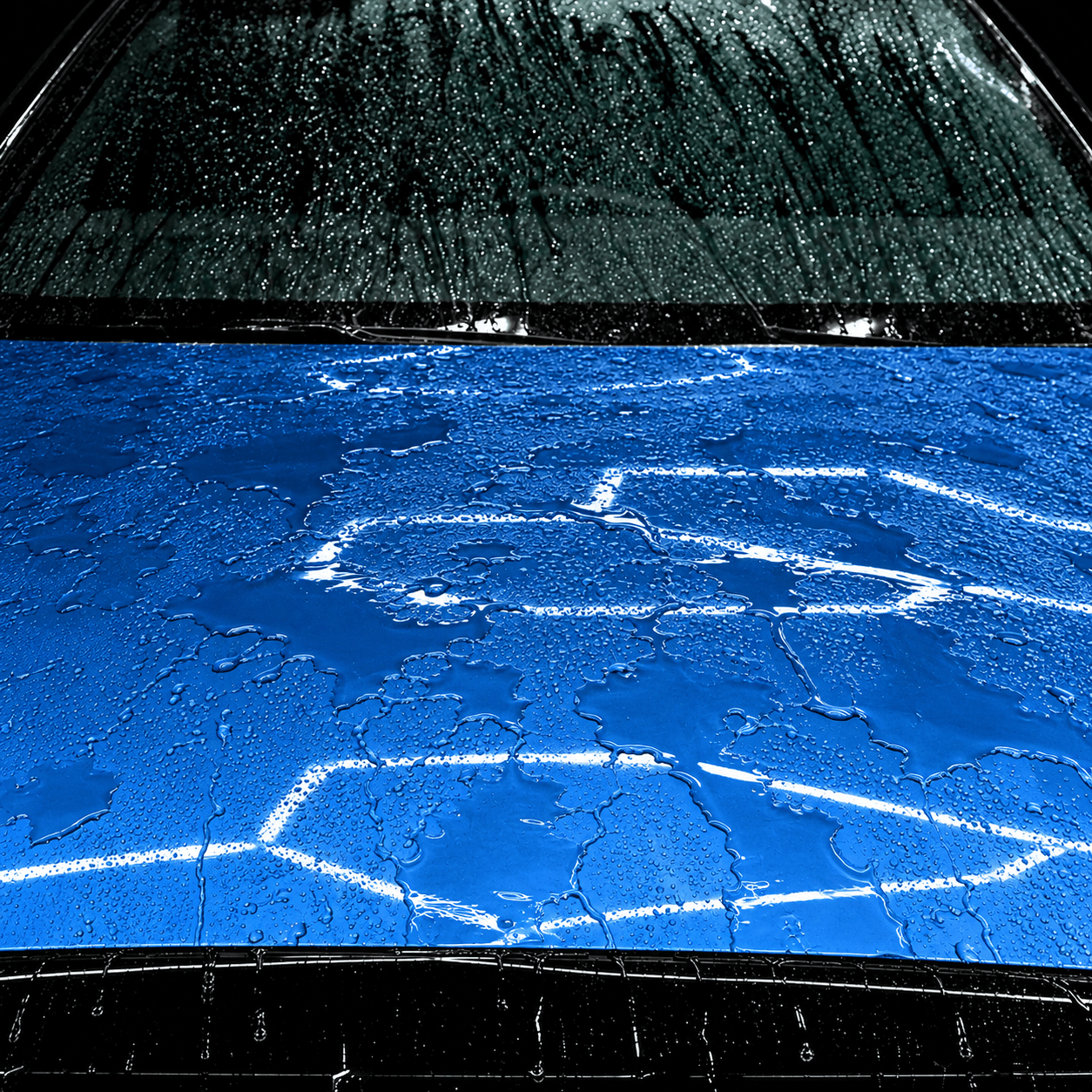 Unprotected vehicle paint panel showing flat water pooling before CleanWorx ceramic coating
