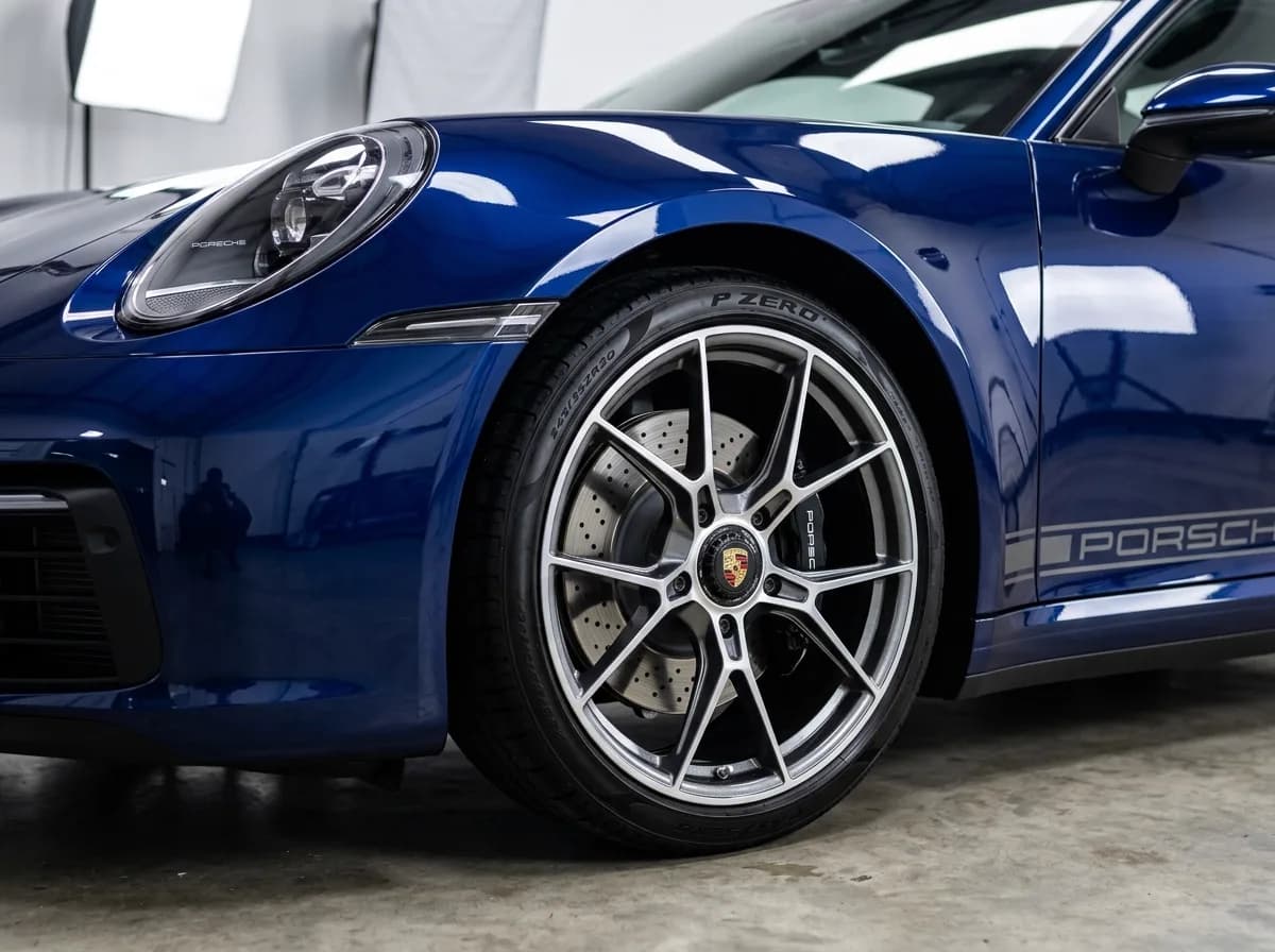 Vehicle wheel, dressed tire, and glossy paint finish after CleanWorx complete mobile detailing service