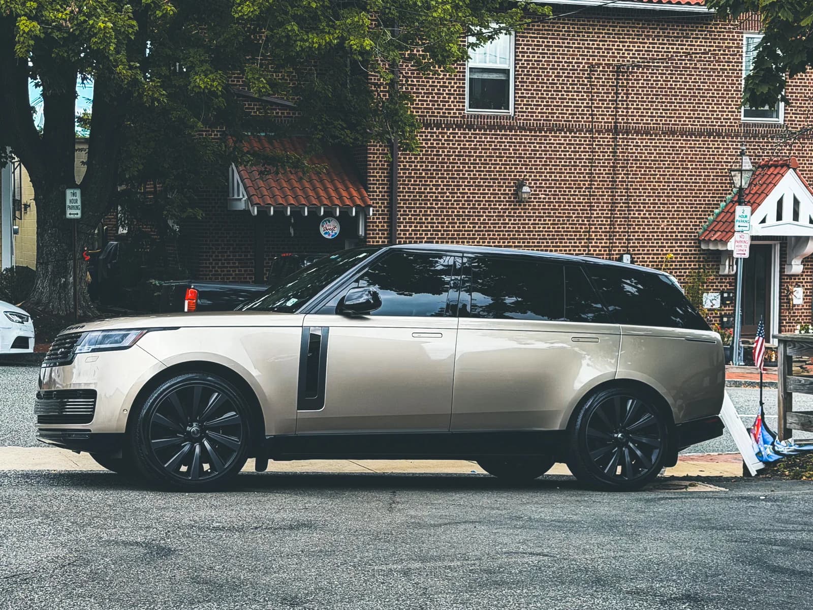 Range Rover in Batumi Gold detailed with ceramic coating and window tinting