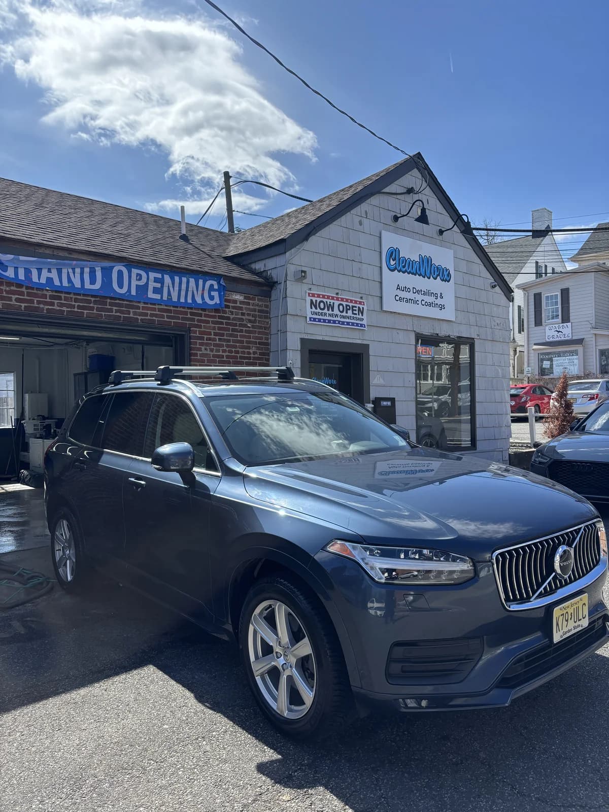 Volvo XC90 luxury SUV detailed outside CleanWorx Grand Opening storefront